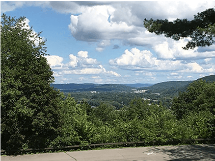 Scenic view of hills and clouds