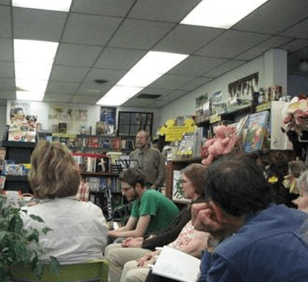 Bookstore gathering with speaker and attendees