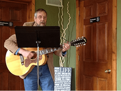 Acoustic guitar player in casual setting