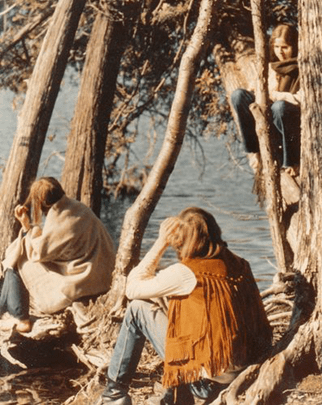 Group of friends near a tree-lined lake