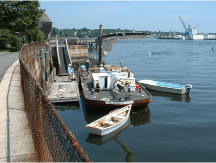 Small boats moored at a pier