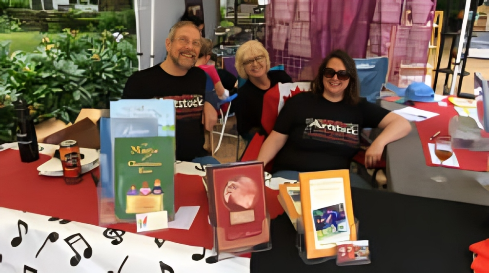 Art-themed booth with three people seated
