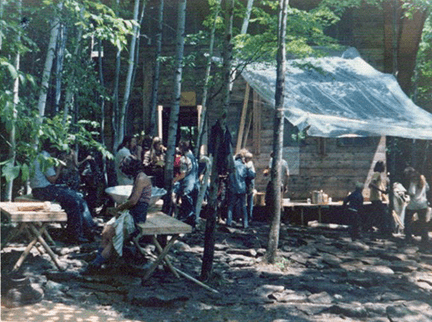 Outdoor gathering under a tarp