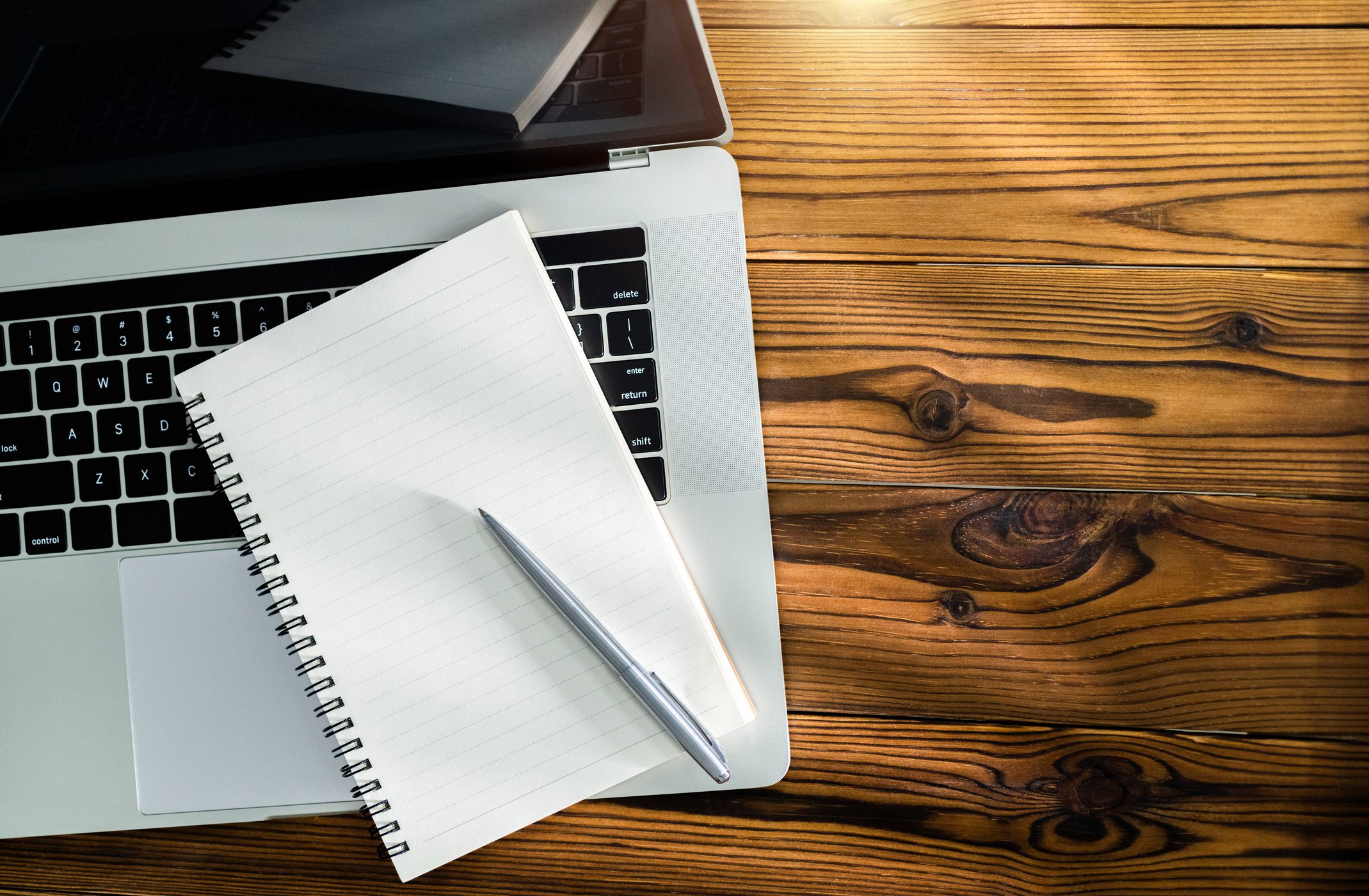 Open laptop with notebook